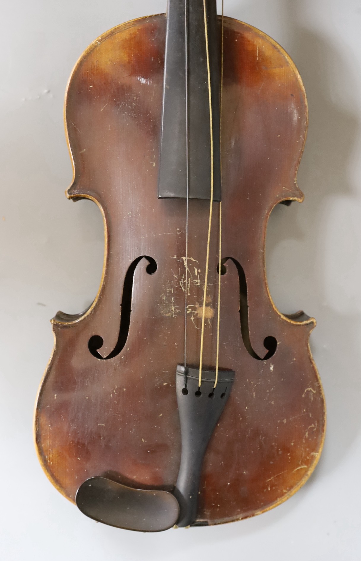 A cased German violin, labelled Stradivarius and dated 1886, back measures 36cm excl button